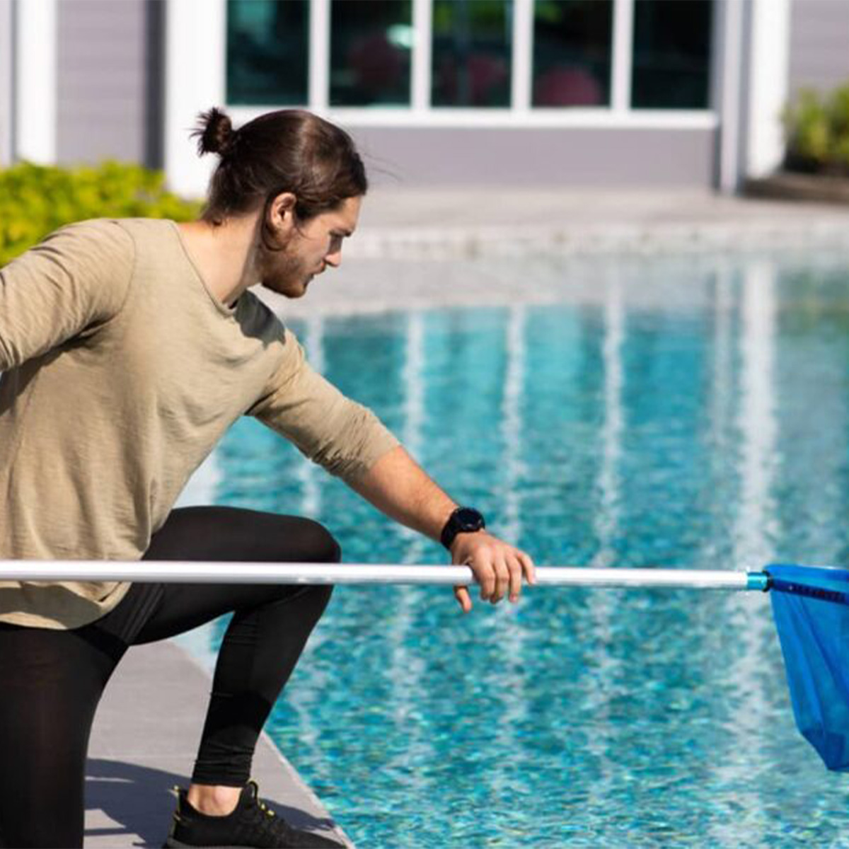 Monthly pool maintenance Cape Town - skimming debris from the water