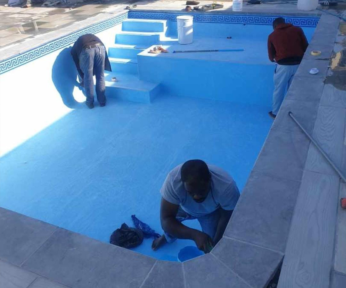 Pool relining Cape Town - team applying a new pool surface