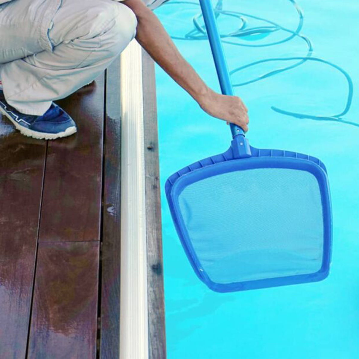 Weekly pool servicing - netting leaves before they sink