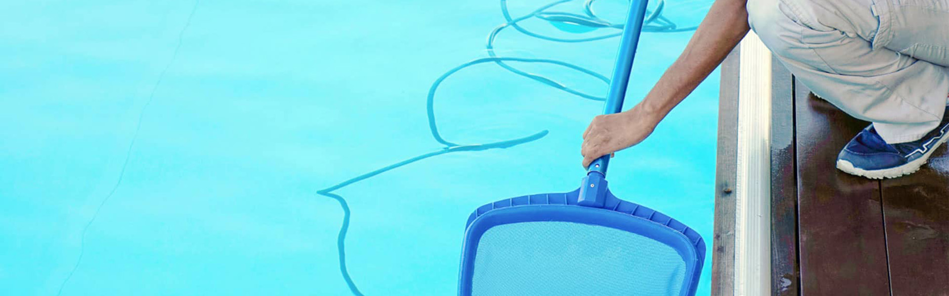 Professional pool maintenance plan - skimming the pool surface