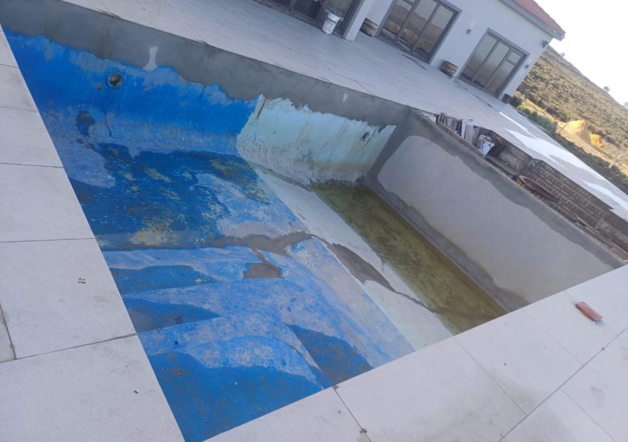 pool relining Cape Farms before - peeling marbelite and rough surface