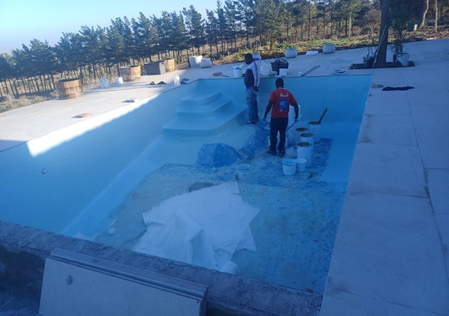 pool relining Cape Farms in progress - crew applying fibreglass lining