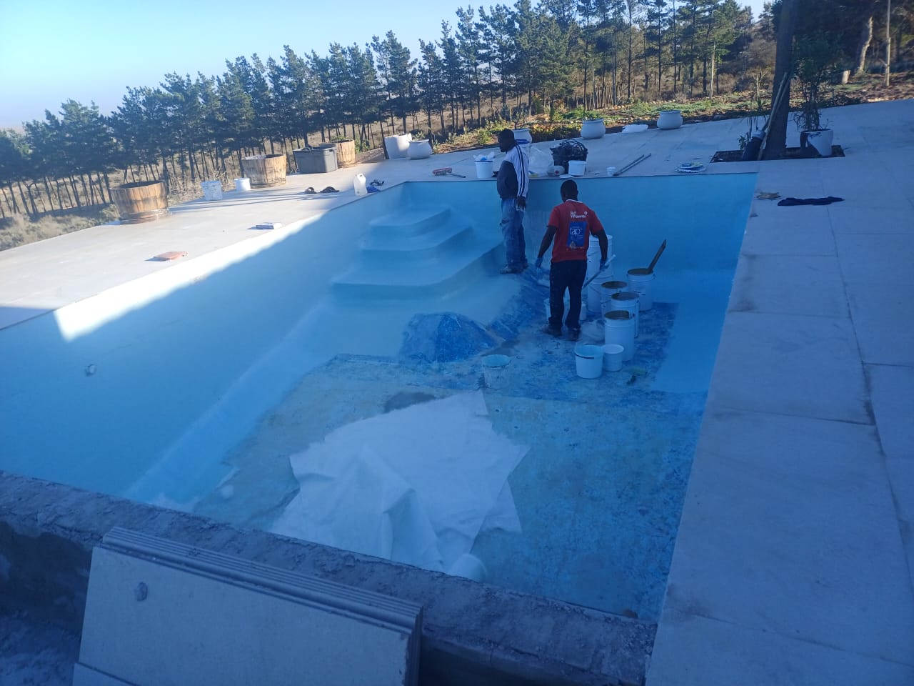 pool relining Cape Farms in progress — crew applying fibreglass lining