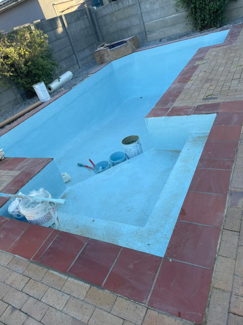 pool relining Kraaifontein in progress — fresh fibreglass lining on the prepped shell