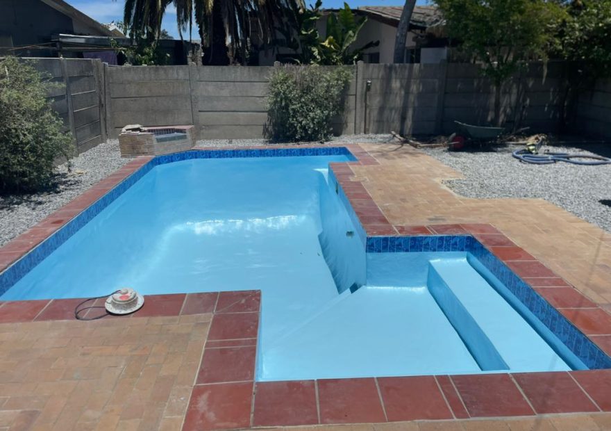 The Real Price of a Full Pool Renovation in the Western Cape | Gibbs Pools pool relining Kraaifontein after - finished pool with new paving and mosaic band