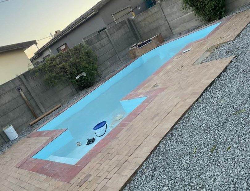 pool relining Kraaifontein after - finished pool and non-slip paving from the end