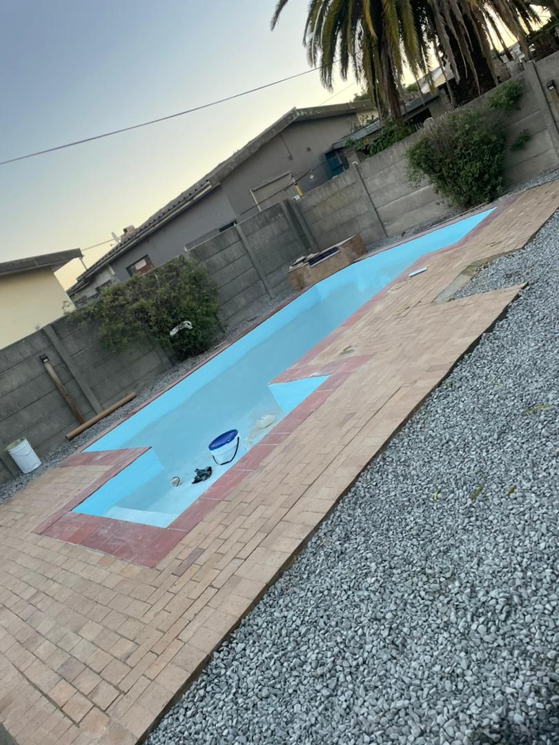 pool relining Kraaifontein after — finished pool and non-slip paving from the end