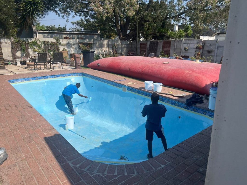Gibbs Pools crew applying fibreglass lining to a 6x3m Durbanville pool