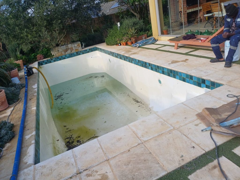 Pool relining Panorama: rough peeling pool surface before relining