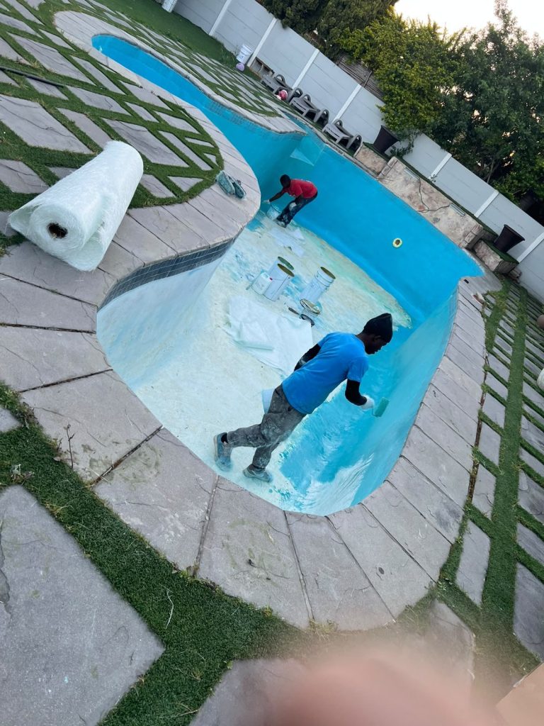 Fibreglass lining being applied to a pool shell in Cape Town