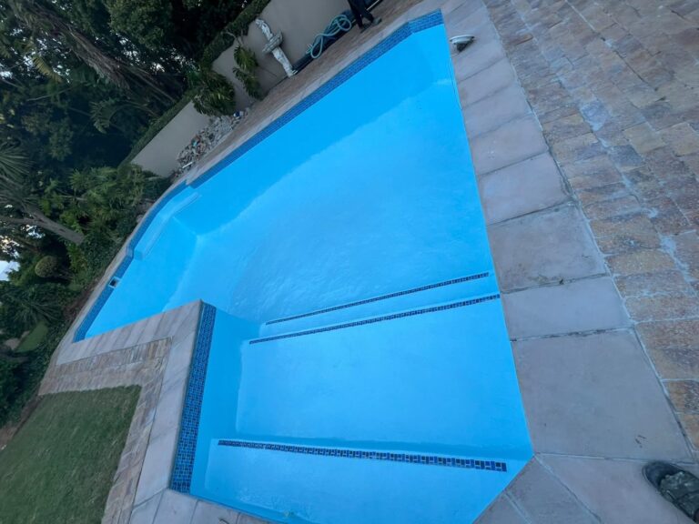 Bellville fibreglass pool relining result: smooth blue finish and new copings
