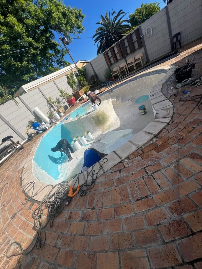 Pool relining Kraaifontein: surface prep on the steps and walls of the gunite pool